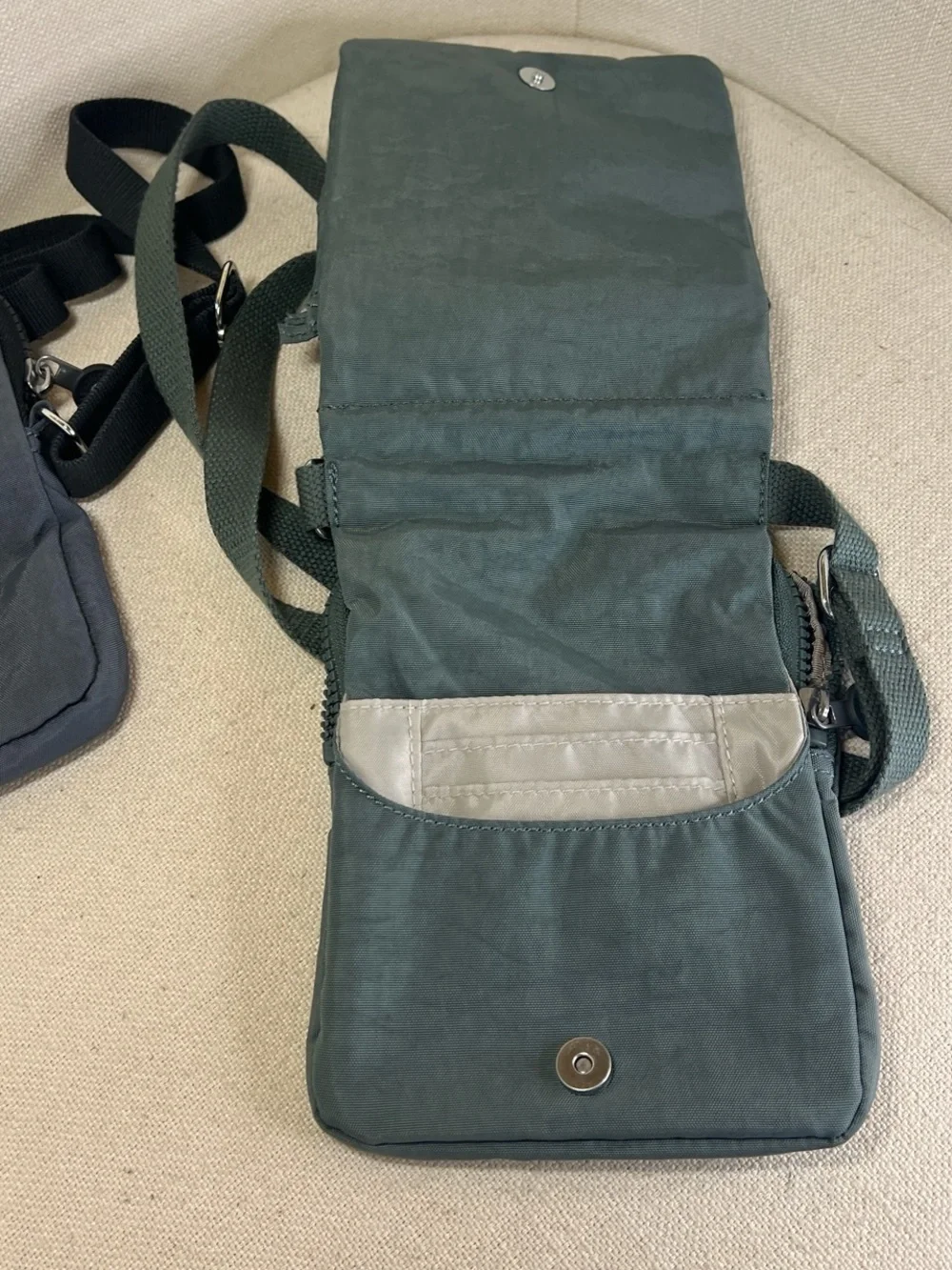 Kipling Dual Mini Crossbody Bags in blue and Green